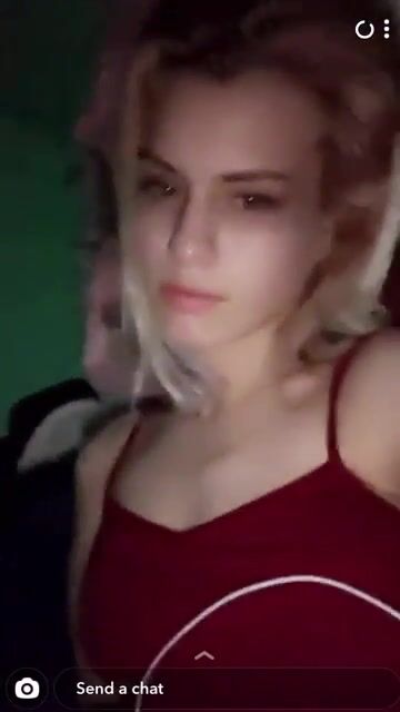 Sucking her own toes