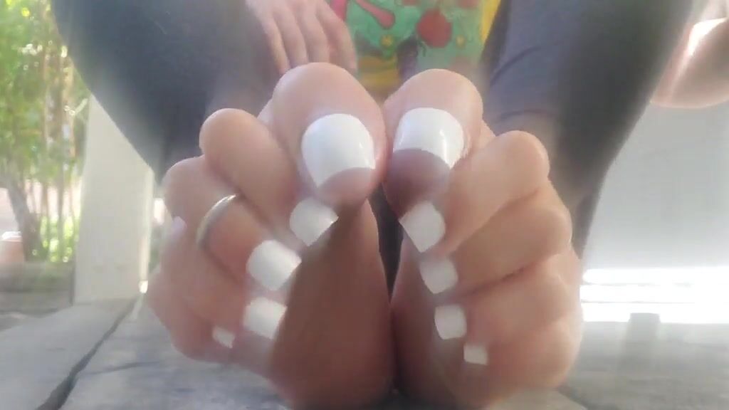 Oiling up my perfect white pedi